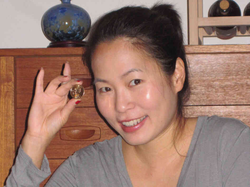 Jane Liaw Liaw orders coins from the U.S. Mint to earn frequent-flier miles.