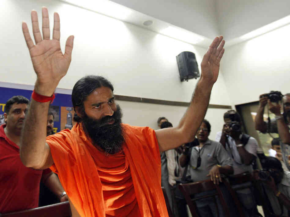 Guru Baba Ramdev's anti-corruption protests helped draw the attention of the government, which then began looking into his financial holdings. Here, he arrives at a media conference in New Delhi, June 26, 2011.