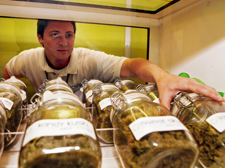 Ryan Cook reaches for a jar of medical marijuana at one of his clinics in Denver on June 24. Ryan Cook reaches for a jar of medical marijuana at one of his clinics in Denver on June 24.
