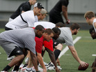 Not A Snickers Commercial: Kansas City quarterback Matt Cassel lines up behind center Rudy Niswanger as players take part in an informal workout. The NFL has been locked in talks between labor and management this summer. Not A Snickers Commercial: Kansas City quarterback Matt Cassel lines up behind center Rudy Niswanger as players take part in an informal workout. The NFL has been locked in talks between labor and management this summer.