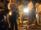Indian police officers look for clues at the blast site in Dadar Kabutarkhana area, in Mumbai. Indian police officers look for clues at the blast site in Dadar Kabutarkhana area, in Mumbai.
