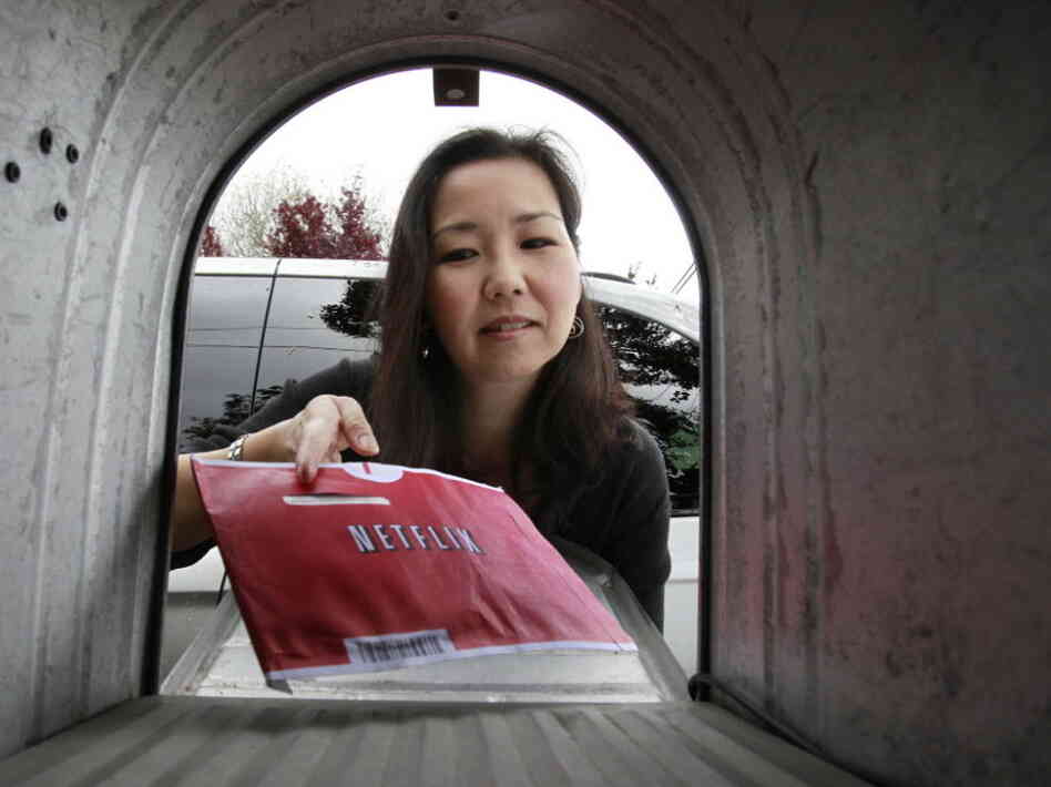 Carleen Ho picks up a movie from her mailbox in Palo Alto, Calif. Carleen Ho picks up a movie from her mailbox in Palo Alto, Calif.