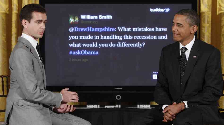 President Barack Obama sits with Twitter co-founder and Executive Chairman Jack Dorsey during a "Twitter Town Hall" in the East Room of the White House in Washington, Wednesday, July 6, 2011.