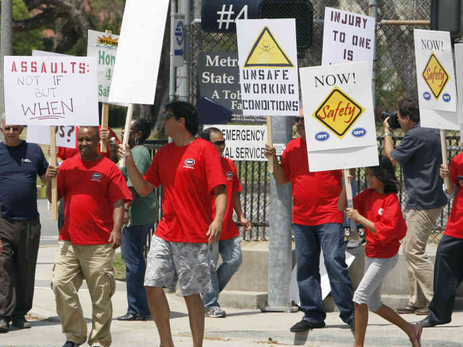 Metropolitan State Hospital employees and supporters gather outside the gates of the hospital in Norwalk, Calif., earlier this month to protest repeated assaults at the hands of mental patients and what they call dangerous working conditions.