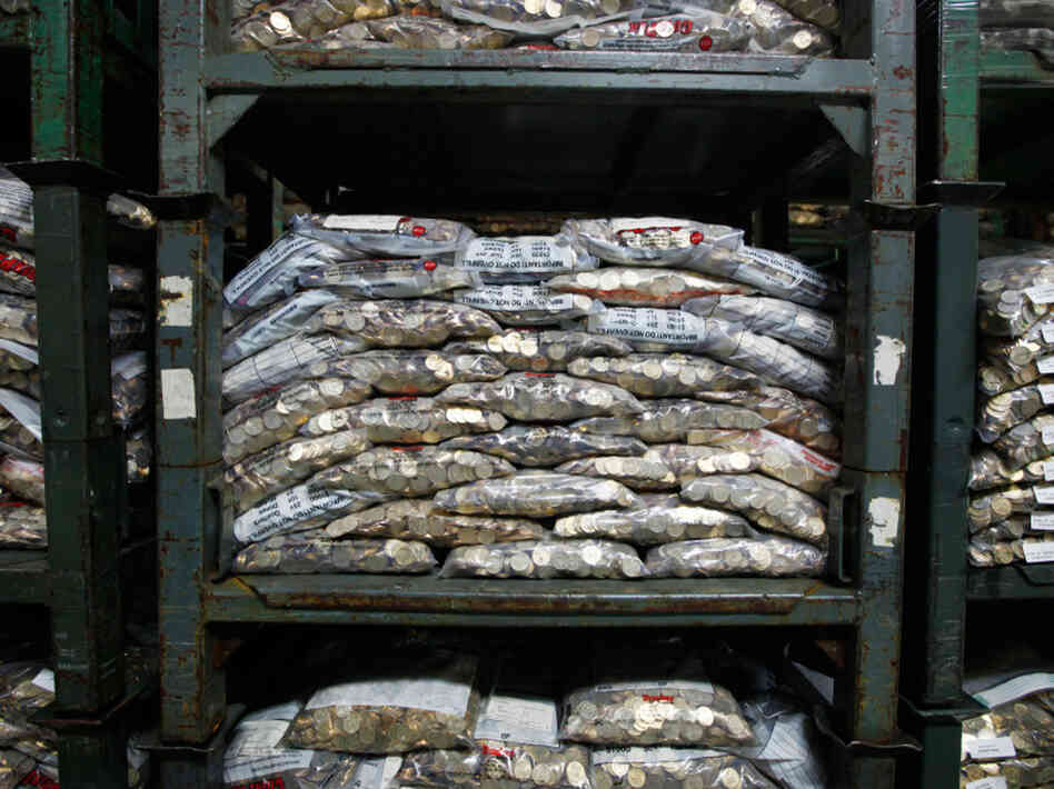 Dollar coins gathering dust in the Fed's Baltimore brach. Dollar coins gathering dust in the Fed's Baltimore brach.