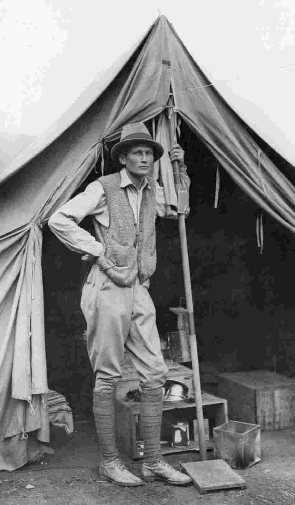 Hiram Bingham stands outside his tent during the 1912 expedition.
