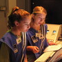 Seventh-graders Sophie Maloro (left) and Unity Bowling "fly" a mission to Mars, part of a summer program at the MathScience Innovation Center in Richmond, Va. Seventh-graders Sophie Maloro (left) and Unity Bowling "fly" a mission to Mars, part of a summer program at the MathScience Innovation Center in Richmond, Va.
