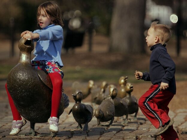 Brianna Henderson and her brother Ian Henderson play on the Make Way for Ducklings statues in Boston. The bronze figures by sculptor Nancy Schon were installed in Boston's Public Garden in 1987. Brianna Henderson and her brother Ian Henderson play on the Make Way for Ducklings statues in Boston. The bronze figures by sculptor Nancy Schon were installed in Boston's Public Garden in 1987.