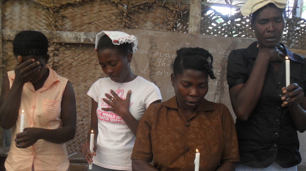 Mourners attend a memorial service for recent cholera victims in Haiti that took place Wednesday  in Savanette, an isolated community in the mountains outside Mirebalais, Haiti.