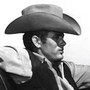 James Dean on the set of the 1956 film Giant, which was filmed on the Ryan Ranch, west of the town of Marfa. The skeleton of the mansion in the background still stands on the ranch today.