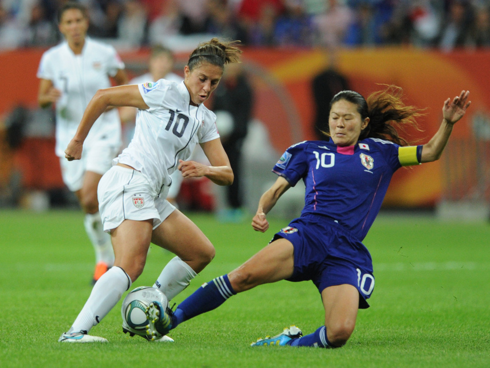 Japan's midfielder Homare Sawa (R) and USA's midfielder Carli Lloyd vie for the ball during the FIFA Women's Football World Cup final match in Frankfurt.