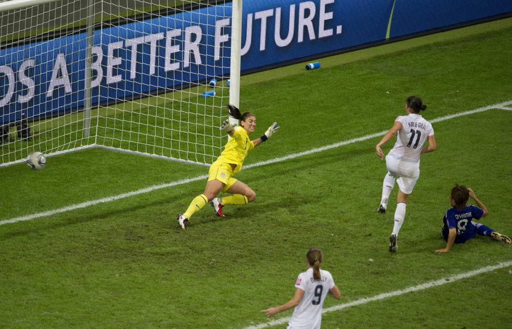 Japan's Aya Miyama scores her country's first goal of the Women's World Cup title match, getting the ball past U.S. goalkeeper Hope Solo. Japan won 3-1 in a penalty shoot-out after overtime expired with the two teams tied, 2-2. Japan became the first Asian nation to win the World Cup.