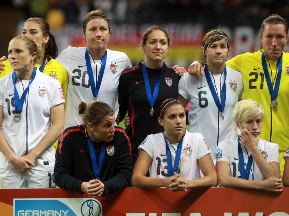 Members of the U.S. women's national team look on after losing the FIFA Women's World Cup Final against Japan. The Americans lost on penalty kicks after overtime expired with the teams tied, 2-2.