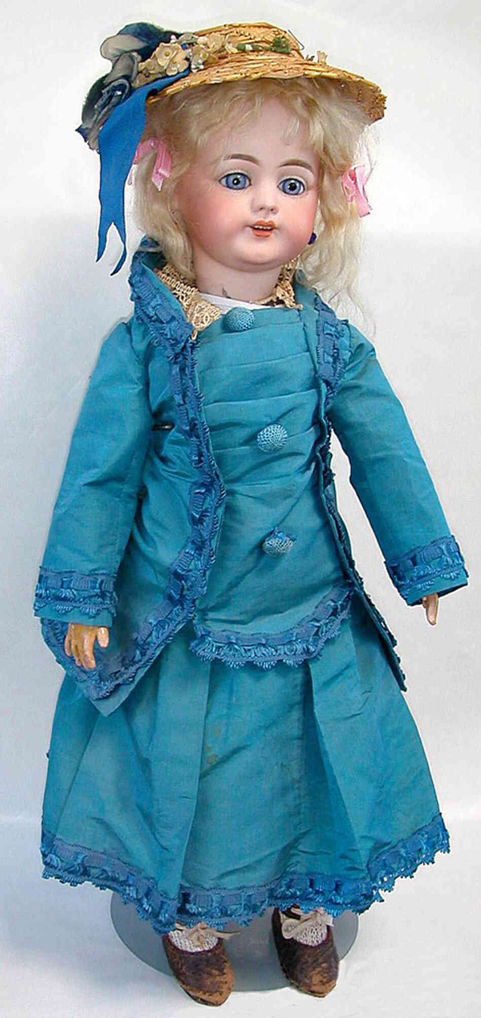 The cylinder was designed to fit a tiny hand-cranked phonograph inside this hollow-bodied doll. The design was not a success. The cylinder was designed to fit a tiny hand-cranked phonograph inside this hollow-bodied doll. The design was not a success.