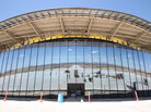 The San Andres Mountains and pieces of construction equipment are reflected in the glass windows of Spaceport America near Upham, N.M., in May. Despite construction delays and difficult working conditions in a remote area of the desert, state officials say New Mexico is committed to seeing the project succeed. The San Andres Mountains and pieces of construction equipment are reflected in the glass windows of Spaceport America near Upham, N.M., in May. Despite construction delays and difficult working conditions in a remote area of the desert, state officials say New Mexico is committed to seeing the project succeed.