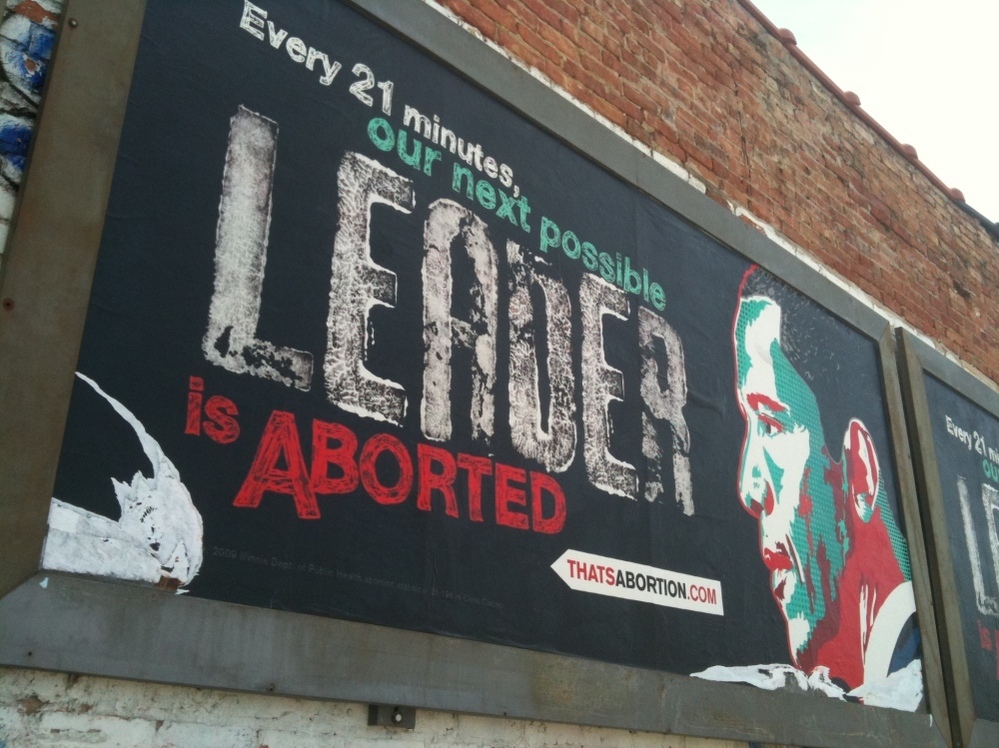 An anti-abortion billboard with President Barack Obama's image is shown by a vacant lot in the Englewood neighborhood of Chicago's South Side Saturday, April 23, 2011. The billboard is from a Texas anti-abortion group, not the Radiance Foundation, whose co-founder appeared in this interview with NPR.