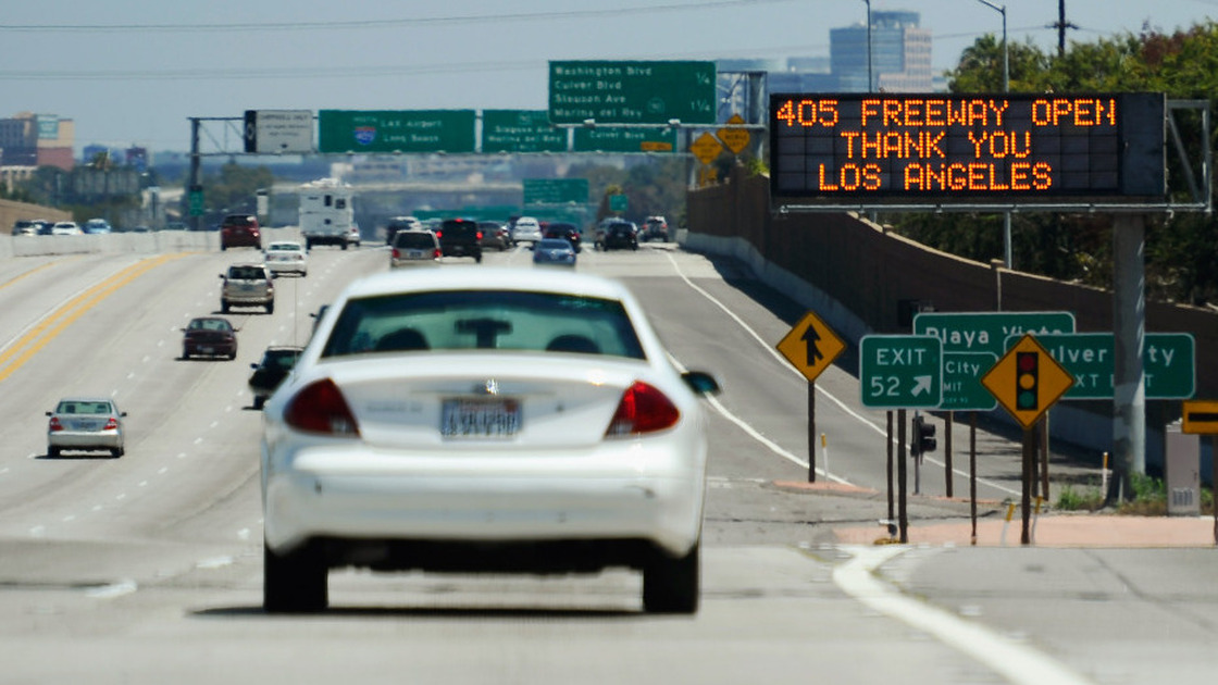 Back on the road: Traffic on a 10-mile stretch of I-405 in Los Angeles started flowing on Sunday, nearly a day earlier than planned.