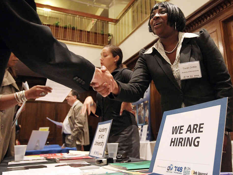 A job seeker shakes hands with a recruiter during the San Francisco Hirevent job fair at the Hotel Whitmore on July 12, 2011 in San Francisco, California. In our second hour, guests talk about bouncing back after long-term unemployment. A job seeker shakes hands with a recruiter during the San Francisco Hirevent job fair at the Hotel Whitmore on July 12, 2011 in San Francisco, California. In our second hour, guests talk about bouncing back after long-term unemployment.