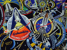 Every space shuttle mission had its own mission emblem, designed and worn by the crews. Centered in this photo are the embroidered patches for the first and last missions, STS-1 and STS-135. The STS-1 emblem is a rare version, produced only for the astronauts and NASA employees. The souvenir edition was slightly different. Every space shuttle mission had its own mission emblem, designed and worn by the crews. Centered in this photo are the embroidered patches for the first and last missions, STS-1 and STS-135. The STS-1 emblem is a rare version, produced only for the astronauts and NASA employees. The souvenir edition was slightly different.