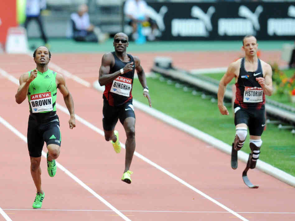 South African runner Oscar Pistorius, right, runs in the 400 meter race in France, July 8, 2011. His time in a race in Italy Tuesday was good enough to send him to the World Championships.
