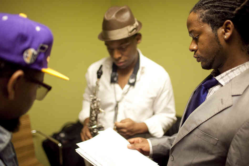 Ben Williams (right) confers with bandmates Marcus Strickland (center) and Jamire Williams backstage.