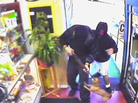 In a photo made from a surveillance video released by the Los Angeles County sheriff's office a chihuahua barks and jumps at a man holding a rifle during a robbery at a smoke shop in Altadena, Calif., on July 7, 2011. In a photo made from a surveillance video released by the Los Angeles County sheriff's office a chihuahua barks and jumps at a man holding a rifle during a robbery at a smoke shop in Altadena, Calif., on July 7, 2011.