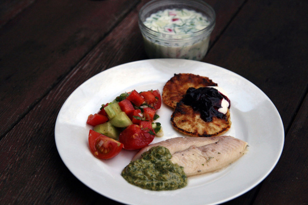 Traditional Soviet summer fare: a bowl of Okroshka (Cold Kefir Soup), Syrniki (Curd-Cheese Pancakes) with berries and sour cream, Grilled Trout with Tarragon and Cilantro Walnut Sauce, and Azerbaijan Salad.