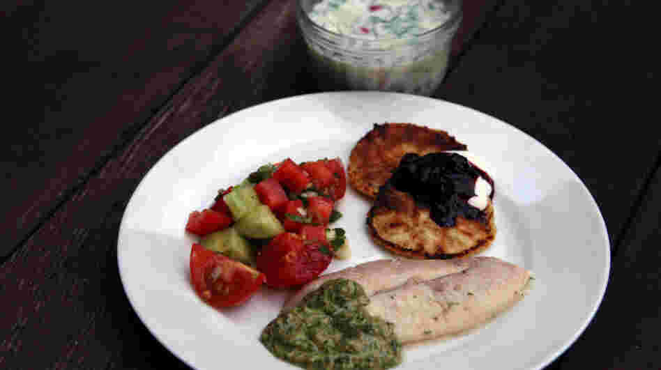 Traditional Soviet summer fare: a bowl of Okroshka (Cold Kefir Soup), Syrniki (Curd-Cheese Pancakes) with berries and sour cream, Grilled Trout with Tarragon and Cilantro Walnut Sauce, and Azerbaijan Salad.