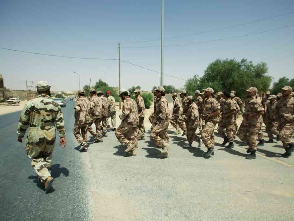 Specially selected rebel fighters march through the streets of Zintan, Libya. These rebels will be trained in urban combat in anticipation of an expected move toward Tripoli. Specially selected rebel fighters march through the streets of Zintan, Libya. These rebels will be trained in urban combat in anticipation of an expected move toward Tripoli.