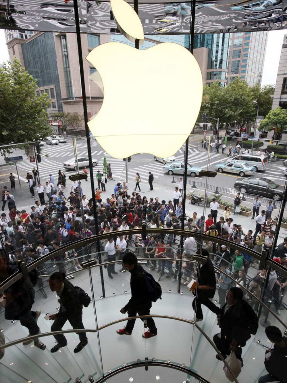Customers line up at an Apple store for the launch of the iPhone 4 in Shanghai in 2010. Lines for everything from luxury handbags to social service programs can go on for days — literally. One entrepreneur in Shanghai will wait in line for you, for around $3 an hour.
