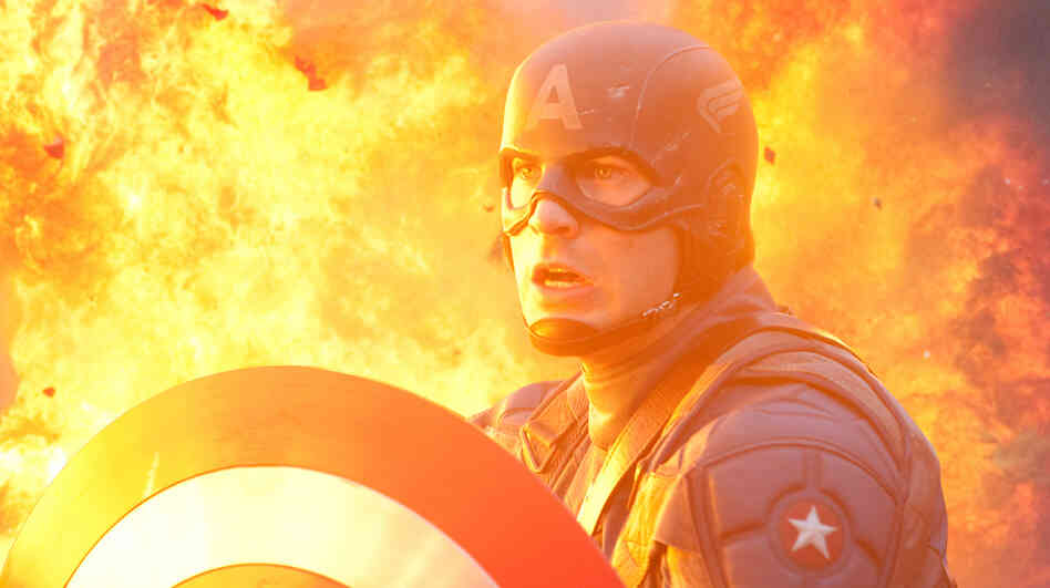 The American Way: A military genetics experiment transforms 98-pound weakling Steve Rogers (Chris Evans) into the iconic red, white and blue crusader. Cap must balance superheroics with his patriotic duty to sell war bonds. The American Way: A military genetics experiment transforms 98-pound weakling Steve Rogers (Chris Evans) into the iconic red, white and blue crusader. Cap must balance superheroics with his patriotic duty to sell war bonds.