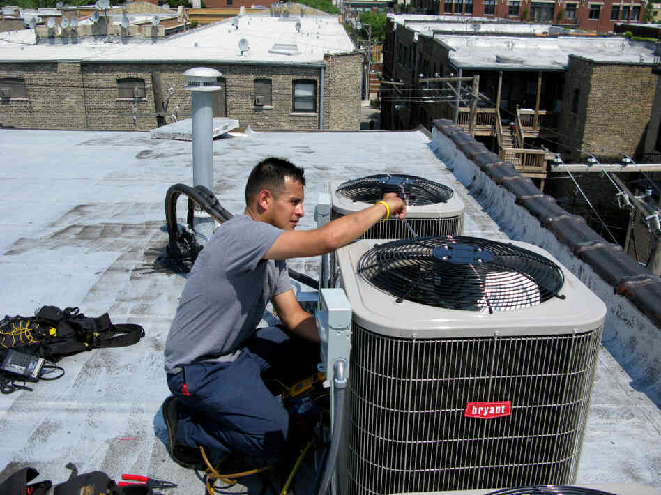 Eric Rebolledo, a repairman for AllTemp heating and air conditioning in Chicago, works on an air-conditioning unit on the roof of an apartment building. "I don't remember it being this hot for at least 10 years that I can recall," he says. "This is unusual, man, so it's gonna create some havoc with the air-conditioning systems." Eric Rebolledo, a repairman for AllTemp heating and air conditioning in Chicago, works on an air-conditioning unit on the roof of an apartment building. "I don't remember it being this hot for at least 10 years that I can recall," he says. "This is unusual, man, so it's gonna create some havoc with the air-conditioning systems."