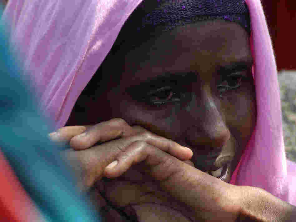 Monday (July 18, 2011): At a refugee camp near Mogadishu, a Somali woman cries after the death of one of her children.