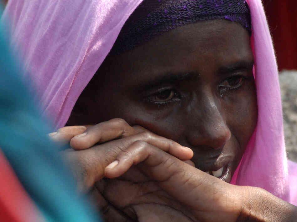 Monday (July 18, 2011): At a refugee camp near Mogadishu, a Somali woman cries after the death of one of her children.