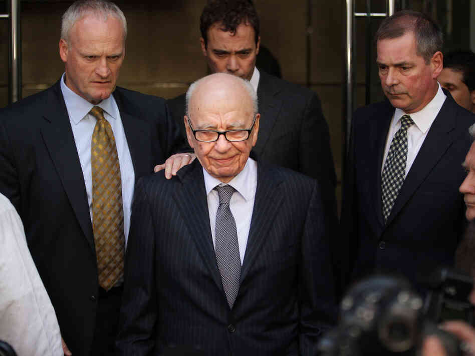 News Corp. Chairman Rupert Murdoch, at center on July 15, after News International chief executive Rebekah Brooks announced her resignation. Speaking before British lawmakers yesterday, Murdoch said "This is the most humble day of my life."