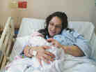 Meg Tudryn holds her newborn daughter, Annalia McKay Tudryn. Photojournalist Alice Proujansky has been documenting births around the world since 2006.