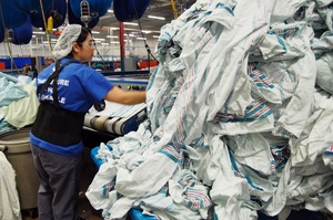 Maria Murillo processes clean baby blankets at Healthcare Laundry Systems in Wheeling, Ill. Last year, the laundry purchased 180,000 blankets to supply to hospitals around Chicago. Each blanket lasts approximately 15 washes before it's thrown out or lost. Maria Murillo processes clean baby blankets at Healthcare Laundry Systems in Wheeling, Ill. Last year, the laundry purchased 180,000 blankets to supply to hospitals around Chicago. Each blanket lasts approximately 15 washes before it's thrown out or lost.