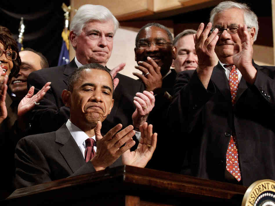 President Obama (with Dodd and Frank) after the bill into law. President Obama (with Dodd and Frank) after the bill into law.