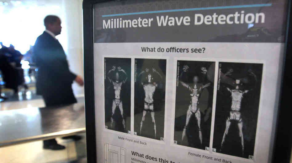 A sign at Chicago's Midway Airport informs travelers about the millimeter wave scanners used to screen passengers.