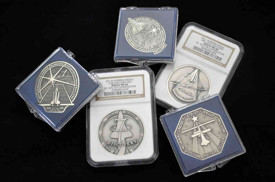 Only astronauts could purchase these medallions (which collectors refer to by the name of the company that minted them). Minted in low number in both gold and silver, some flew aboard the missions they commemorate.  Pictured clockwise from top: Robbins medals for missions STS-116, STS-1, STS-121, STS-95 and STS-115.