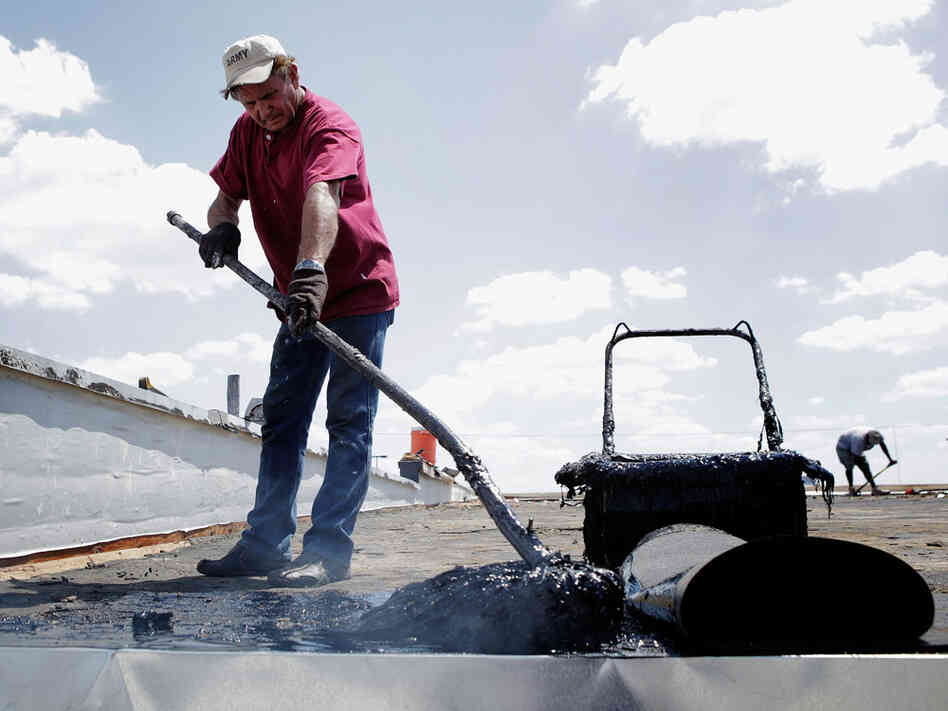 Harold Ferslew, owner of Capitol Roofing Company, spreads 550 degree hot tar on a roof on July 20, 2011 in Oklahoma City, Oklahoma. In our second hour, meteorologists talk about the severe heat wave affecting much of the U.S. Harold Ferslew, owner of Capitol Roofing Company, spreads 550 degree hot tar on a roof on July 20, 2011 in Oklahoma City, Oklahoma. In our second hour, meteorologists talk about the severe heat wave affecting much of the U.S.