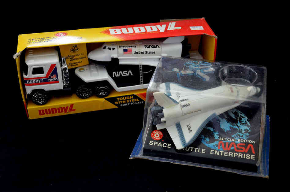Early space shuttle toys dating to the beginning of the program, including a 1979 space shuttle Enterprise toy and a BuddyL replica of space shuttle Discovery. Enterprise toys in particular capture a future that never was (Enterprise never flew in space but was used only as a prototype for atmospheric approach and landing tests).