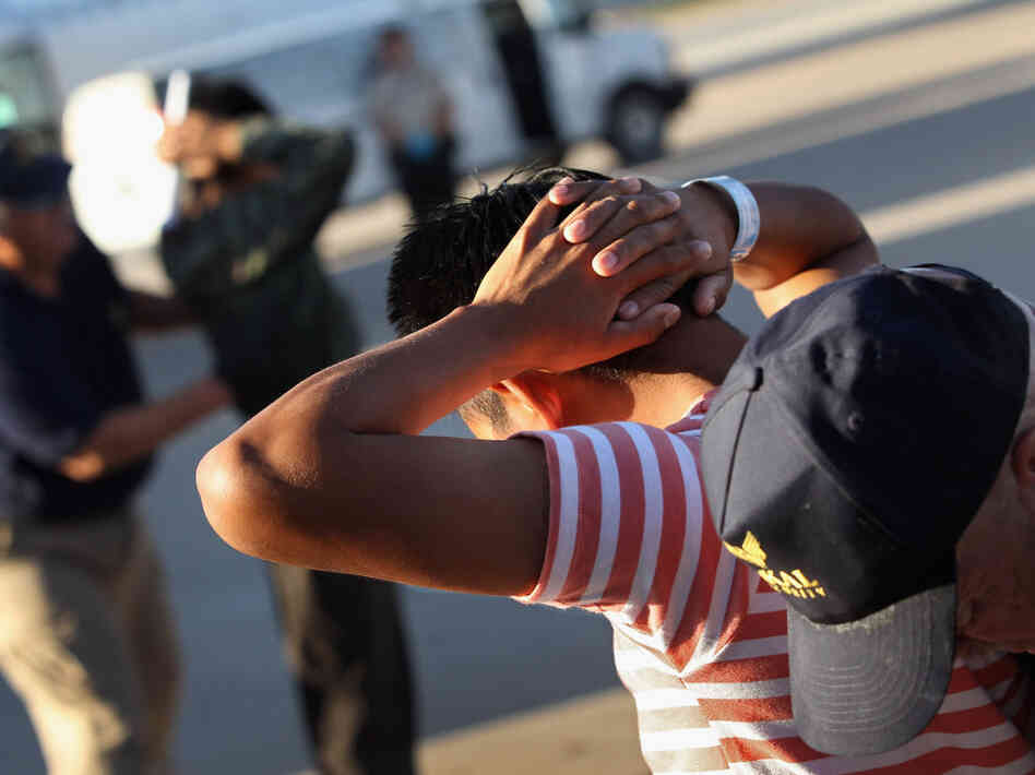 Illegal immigrants from Guatemala are body searched before boarding a deportation flight on June 24, 2011 in Mesa, Arizona. Each month the U.S. Immigration and Customs Enforcement agency sends thousands of undocumented immigrants back to Guatemala. Many have been caught by in the Secure Communities data-sharing program.