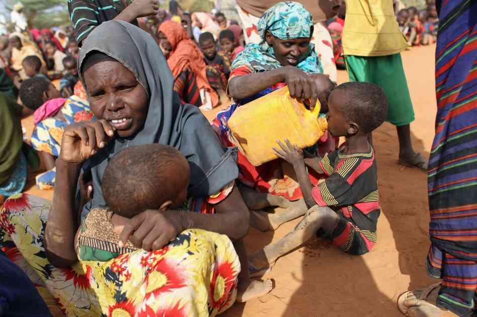 Refugees wait in the registration area of the Ifo refugee camp on July 20. 