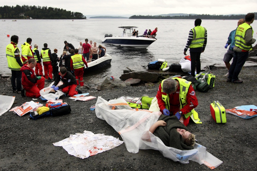 Emergency personnel check on victims who were rescued from the water. 