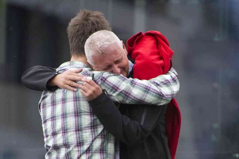 A survivor of the camp shooting embraces his father in Sundvolden, about 25 miles outside Oslo.  