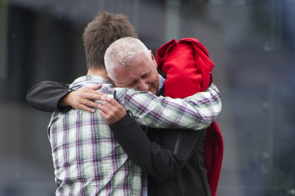 A survivor of the camp shooting embraces his father in Sundvolden, about 25 miles outside Oslo.  