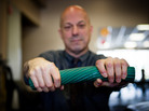 Larry Holzman does a series of eccentric wrist exercises using a rubber bar called the Thera-Band FlexBar. Larry Holzman does a series of eccentric wrist exercises using a rubber bar called the Thera-Band FlexBar.