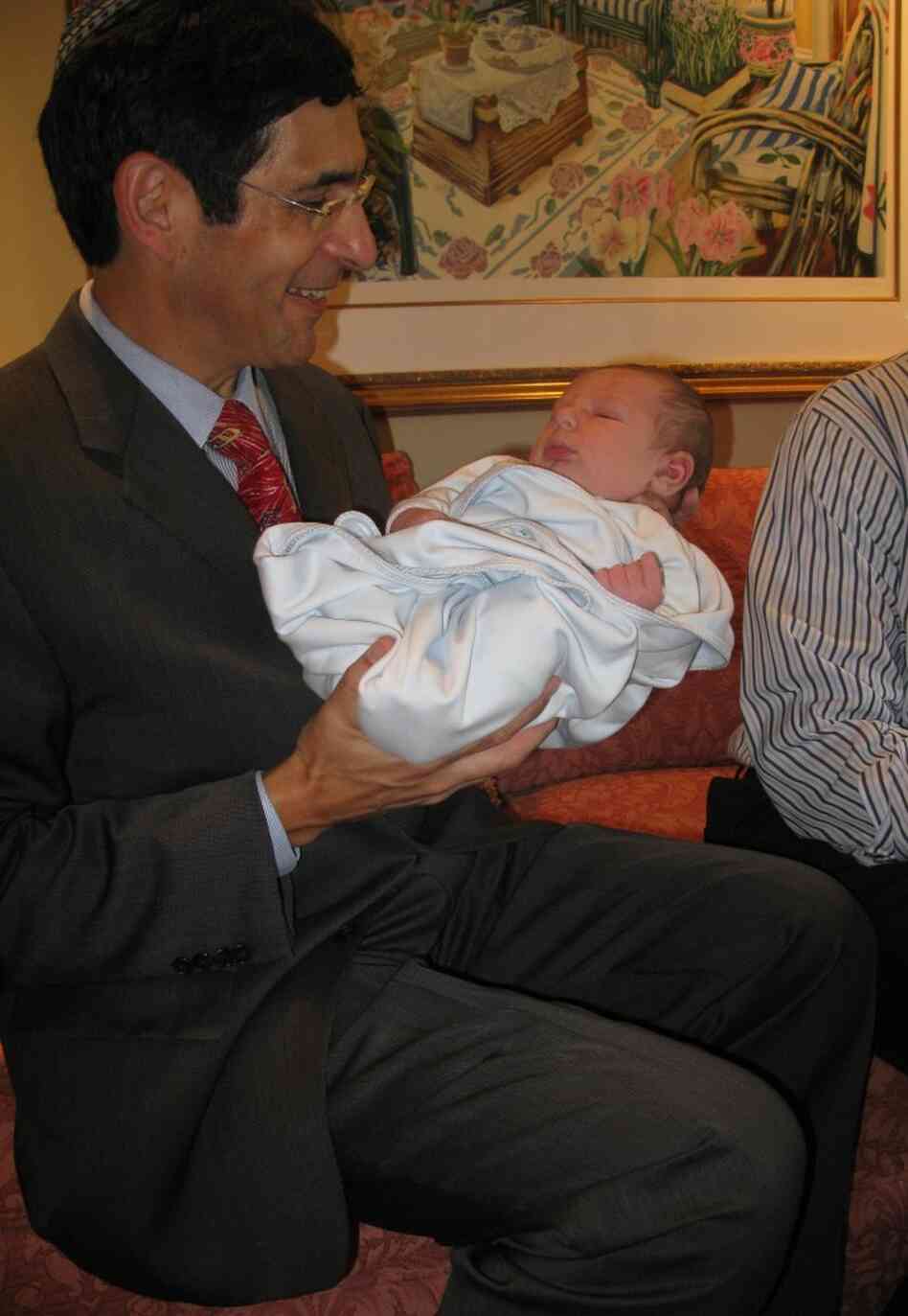 Dr. Steven Adashek,a mohel, performed Bram's bris. He administered a local anesthetic to the baby boy. Dr. Steven Adashek,a mohel, performed Bram's bris. He administered a local anesthetic to the baby boy.