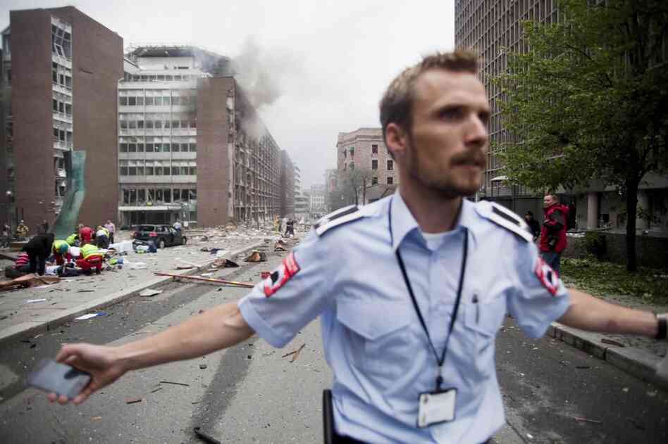 An official attempts to clear the street. 